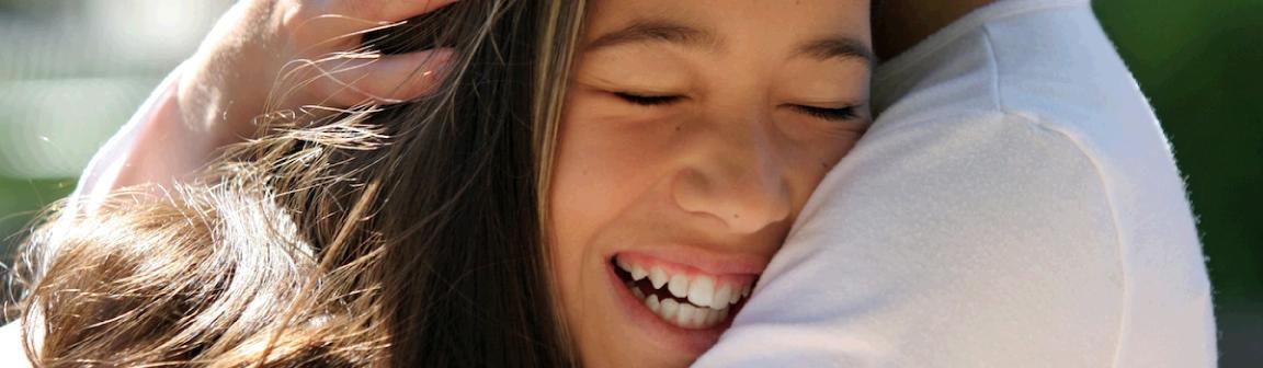 motherhuggingherhappydaughter